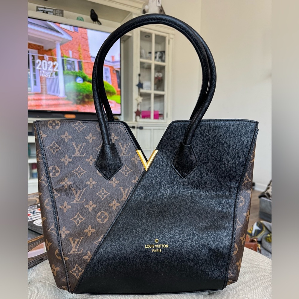 Brown and black purse with gold hardware